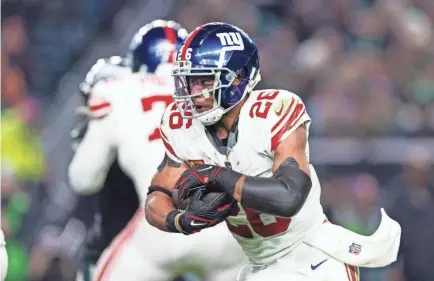  ?? BILL STREICHER/USA TODAY SPORTS ?? Saquon Barkley rushed for 962 yards and six TDs for the Giants during the 2023 NFL season.