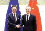  ??  ?? JASON LEE/REUTERS European Commission Vice President Jyrki Katainen (R) shakes hands with Chinese Vice Premier Liu before the Eu-china High-level Economic Dialogue at Diaoyutai State Guesthouse in Beijing, China, on June 25, 2018.