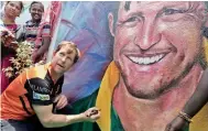  ?? — ASIAN AGE ?? Jonty Rhodes signs an autograph on a painting during his visit to a Chennai school.
