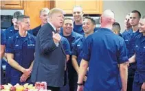  ?? MANDEL NGAN/GETTY-AFP ?? President Donald Trump visits with personnel Thursday at U.S. Coast Guard Station Lake Worth Inlet in Riviera Beach.