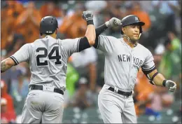  ?? Gail Burton / Associated Press ?? The Yankees’ Giancarlo Stanton, right, celebrates his home run with Gary Sanchez in the third inning on Saturday.