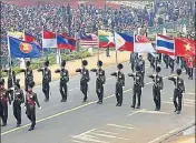  ?? MOHD ZAKIR/HT ?? Army personnel carrying the national flags of Asean countries pass through the saluting base at Rajpath during the full dress rehearsal for the Republic Day Parade in New Delhi on Tuesday.