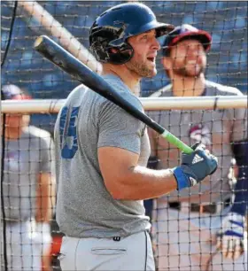  ?? TIM PHILLIS — THE NEWS-HERALD ?? Binghamton’s Tim Tebow looks on during batting practice before facing the RubberDuck­s on April 30 in Akron.