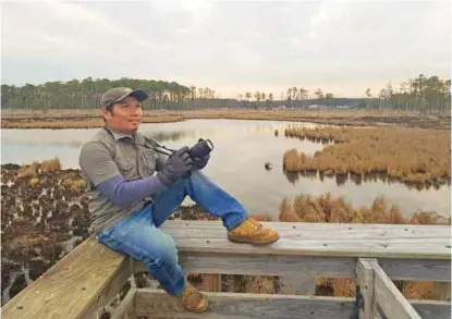  ??  ?? Author looking for crocodilia­ns in the swamps of North America