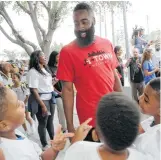  ?? Elizabeth Conley / Houston Chronicle ?? James Harden’s summer activities in Houston included a visit to the Boys & Girls Club on Friday, delivering backpacks and supplies to 150 children.