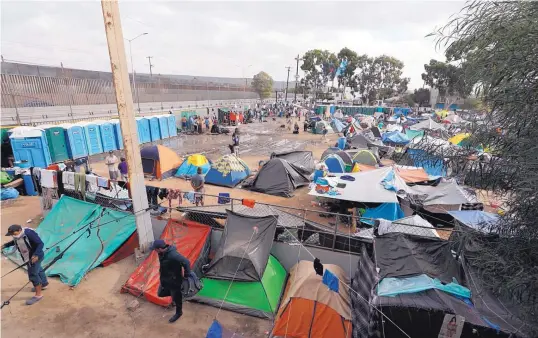  ?? REBECCA BLACKWELL/ASSOCIATED PRESS ?? Tents are set up inside a sports complex where more than 5,000 Central American migrants are sheltering in Tijuana, Mexico.