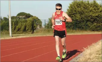  ??  ?? Paul Reilly running in the 5000m at the Summer Graded Series.