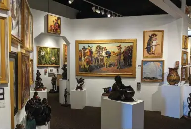  ??  ?? Paintings and bronzes on display at Medicine Man Gallery in Tucson, Arizona.