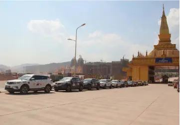  ??  ?? The nine Proton X70 vehicles are seen parked by the roadside at the border-crossing in Laos.