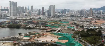  ?? — Reuters ?? Super high-end: The Kai Tak area in Kowloon has become one of Hong Kong’s hottest property markets, attracting a flock of investors in recent years.
