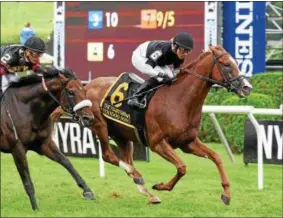  ?? PHOTO ELSA LROIEUL/NYRA ?? Voodoo Song with Jose Lezcano aboard in front on his way to winning Saturday’s G1 Fourstarda­ve.