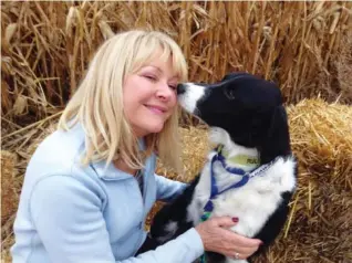  ?? LUCY LUGINBILL/TRI-CITY HERALD/TRIBUNE NEWS SERVICE ?? Kim Jasper of Moses Lake, Wash., shares a special moment with Ruckus, the border collie she rescued.