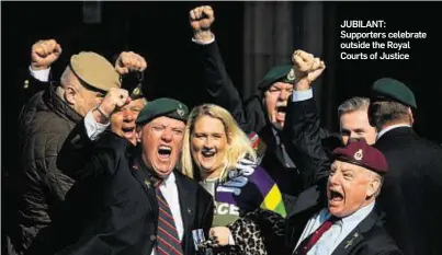  ??  ?? JUBILANT: Supporters celebrate outside the Royal Courts of Justice