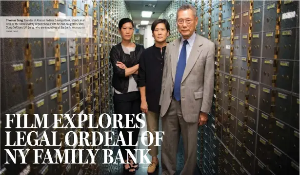  ?? PROVIDED TO CHINA DAILY ?? Thomas Sung, founder of Abacus Federal Savings Bank, stands in an aisle of the bank’s safety deposit boxes with his two daughters, Vera Sung (left) and Jill Sung, who are executives at the bank.