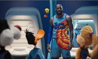  ??  ?? LeBron James gives his Looney Tunes teammates a pep talk in “Space Jam: A New Legacy.”