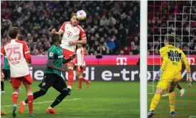  ?? ?? Harry Kane heads in his second goal. Photograph: Matthias Schräder/AP