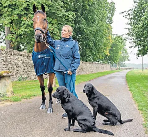  ??  ?? Close ties: Tindall, above, with her horse High Kingdom (known as Trevor) and, below, with husband Mike and daughter Mia