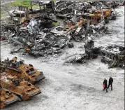  ?? EMILIO MORENATTI/AP ?? The wrecks of military vehicles can be seen Saturday from the air in Bucha, on the outskirts of Kyiv.