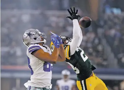  ?? RON JENKINS/THE ASSOCIATED PRESS ?? Dallas Cowboys wide receiver Terrance Williams, left, watches as Green Bay Packers cornerback Damarious Randall breaks a pass intended for Williams late in the second half of Sunday’s game in Arlington, Texas.