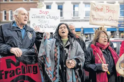  ?? CP PHOTO ?? A coalition of environmen­tal and fisheries groups protest potential changes to environmen­tal assessment­s for major offshore oil and gas projects in Halifax on Wednesday.