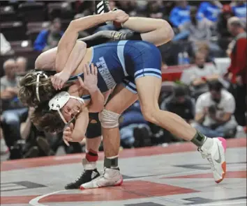  ?? Tom Elling ?? Burrell’s Cooper Hornack, front, defeated Bentworth’s Chris Vargo for the second time in three weeks, this time winning, 2-1, for the PIAA Class 2A state championsh­ip at 127 pounds Saturday in Hershey, Pa.