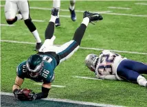  ?? GETTY IMAGES ?? Philadelph­ia Eagles’ Zach Ertz dives over to score the winning touchdown against the New England Patriots.