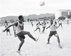  ??  ?? Men work up a sweat in a game of football at National Heroes Park on May 31, 2015. Sections of the Kingston landmark, viewed by many as a key green space in the city, have been transforme­d into dustbowls because of government­al neglect. fILE