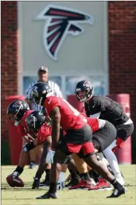  ?? The Associated Press ?? SHUTTING IT DOWN: Atlanta Falcons quarterbac­k Matt Ryan ( 2) and the offense prepare to run a play on July 25, 2019, during their NFL training camp practice in Flowery Branch, Ga. The Falcons shut their facility Thursday following one new positive test for COVID- 19. The team remains scheduled to play at Minnesota on Sunday.