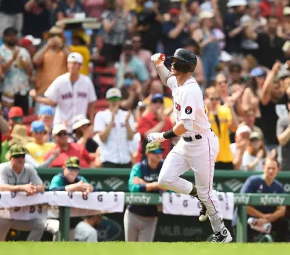  ?? Kathryn Riley, Getty Images ?? Boston’s Trevor Story celebrates as he runs the bases after hitting a solo home run in the sixth inning against the Seattle Mariners at Fenway Park on Sunday.