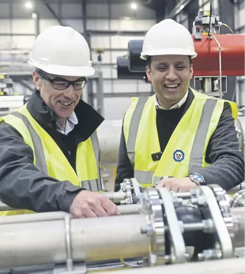  ?? ?? Scottish Labour leader, Anas Sarwar, was out and about at the Scottish Enterprise Technology Park in East Kilbride. He is pictured here with Muir Porter, head of UK National Flow Standards, as his party set out what it would do to support businesses and encourage tech investment