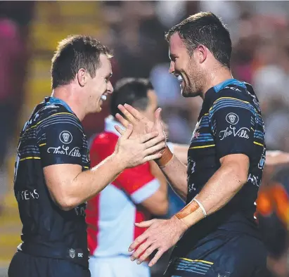  ??  ?? MATES: Michael Morgan and Gavin Cooper celebrate a try during the 2016 season.