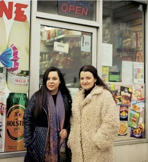  ??  ?? Andrea with Georgina’s sister Sara outside Clifton Food & Wine, the shop she visited on the day she disappeare­d. Portrait by Tori Ferenc