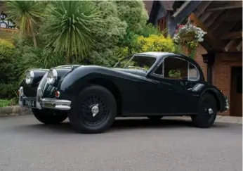  ?? DAN ILIKA PHOTOS/AUTOGUIDE.COM ?? The 1955 Jaguar XK140 3.4 SE Fixed Head Coupe is strikingly beautiful with an incredibly curvaceous body.