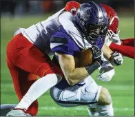  ?? Special to the NWA Democrat-Gazette/DAVID BEACH ?? Fayettevil­le’s Jacob Sharits (right) scores as Cabot defensive back Kyle McIntire defends during Friday’s game.