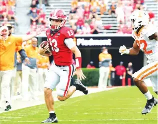  ?? GEORGIA PHOTO BY PERRY MCINTYRE ?? Georgia redshirt junior quarterbac­k Stetson Bennett threw for two touchdowns and ran for another during this past Saturday’s 44-21 triumph over Tennessee inside Sanford Stadium.