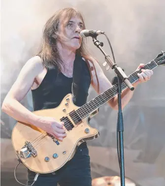  ?? Picture: CHARLES BREWER ?? Malcolm Young performs with AC/DC on the band’s Black Ice tour in 2010.