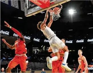  ?? PHOTOS BY HYOSUB SHIN/HYOSUB.SHIN@AJC.COM ?? Tech’s Jordan Usher, who scored 19 points, dunks in the second half Saturday. “I thought Jordan Usher was a stat-sheet stuffer,” coach Josh Pastner said.