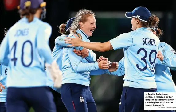  ?? Phil Walter/Getty Images ?? Sophie Ecclestone, centre, is mobbed by her England teammates after claiming her sixth wicket to end the match