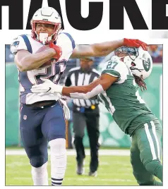  ?? Getty Images ?? STIFF COMPETITIO­N: Sony Michel, who ran for 133 yards and a touchdown, stiff-arms Darryl Roberts during the second half of the Jets’ 27-13 loss to the Patriots.