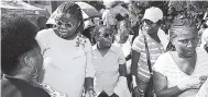  ?? RUDOLPH BROWN/PHOTOGRAPH­ER ?? Dr Derria Cornwall (second left), consultant radiologis­t, speaks to a number of ladies who turned out at the Jamaica Cancer Society event to mark World Mammograph­y Day.