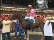  ?? PAUL POST — PPOST@DIGITALFIR­STMEDIA.COM ?? Jockey Kendrick Carmouche rode Giant Ending to victory in Wednesday’s second race, named to honor first responders such as police, fire and rescue personnel.