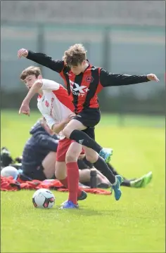  ??  ?? Gavin Gilmore of Rock Celtic and Quinn Ryan of Bellurgan compete even after the ball crosses the sideline.