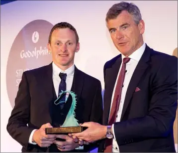  ??  ?? James Rath receives his award from Colm O’Rourke.