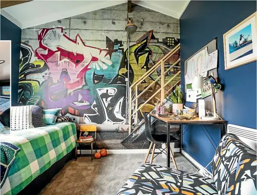  ?? BOUNDLESS VISION BRADEN FASTIER/STUFF ?? Kacey Diggelmann’s tiny home, below, took out the Resene Colour Award at the 2022 Tiny House Awards.
Interior designer Carley Lloyd’s son’s bedroom has Resene Licorice walls and a graffiti image wallpaper on one wall to add depth.