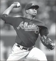  ?? KATHY WILLENS / The Associated Press ?? Atlanta’s Julio Teheran delivers a pitch to the plate during Wednesday’s game.