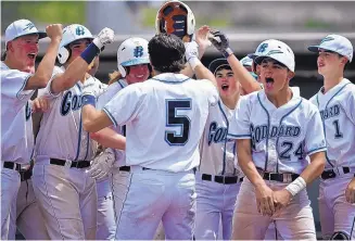  ?? MARLA BROSE/JOURNAL ?? Cameron Stevenson, center, is shown celebratin­g with his Goddard teammates after he hit a home run in the Class 5A semifinals in May. Stevenson is one of five UNM true freshman from New Mexico.
