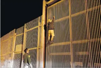  ?? Gary Coronado Los Angeles Times ?? ON A RECENT, typically quiet night: “I’ve got a single,” radioed Border Patrol Agent Eduardo Olmos. He detained a Mexican man from Guerrero state trying to climb the border fence.