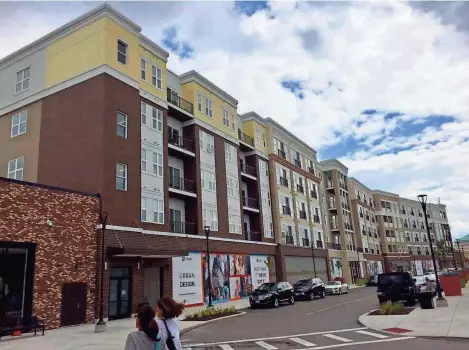  ?? TOM DAYKIN / MILWAUKEE JOURNAL SENTINEL ?? Dempsey Place apartments is one of two new apartment buildings at The Corners mixed-use developmen­t in the Town of Brookfield.