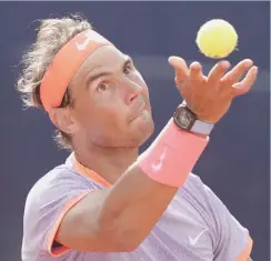  ?? AFP ?? Spain’s Rafael Nadal serves the ball to Australia’s Alex De Minaur during the ATP Barcelona Open match at the Real Club de Tenis in Barcelona.—