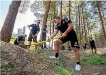  ?? PHOTO: CCC NEWSLINE ?? Kiwis rugby league forward Elijah Taylor, foreground, on the end of a shovel at the Christchur­ch Adventure Park yesterday, with Shaun Johnson and captain Adam Blair toiling behind him.